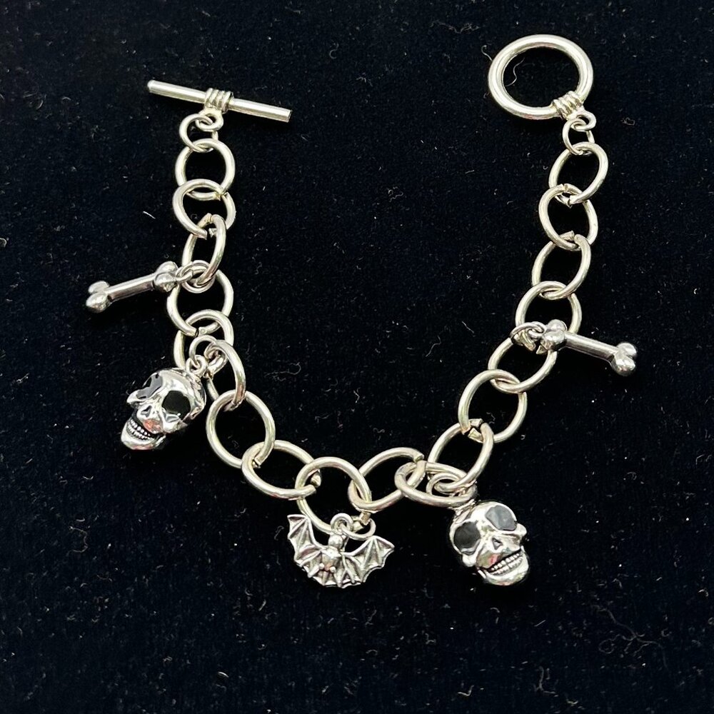 Goth Silver-tone skull, bat and bones charm bracelet.